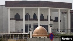 Afghanistan's new parliament building is seen after rockets hit its compound in Kabul, March 28, 2016. 