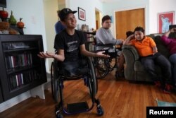 From left, Carlos Castro,15, Daniel Solis,14, and Alexis Pineda, 7, all from Nicaragua, speak at the home provided by the Global Medical Relief Fund in the Staten Island borough of New York, March 24, 2017.