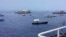 In this photo provided by the Philippine Coast Guard, fishing boats carrying a nongovernment coalition called Atin Ito, Tagalog for This is Ours, pass by waters off Palauig Point, Zambales province, northwestern Philippines as they head toward Scarborough Shoal on May 15, 2024.