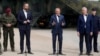 FILE - Poland's Prime Minister Donald Tusk, center, Defense Minister Wladyslaw Kosiniak-Kamysz, center left, and Interior Minister Tomasz Siemoniak, visit troops patrolling the border with Belarus, in Dubicze Cerkiewna, eastern Poland, May 29, 2024. 