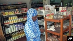 A woman shops in a well-stocked food shop in Bujumbura, Burundi (File)