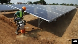 A Ugandan worker builds a solar plant in Soroti about 300 kilometers east of Uganda capital Kampala. 