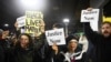 Black Lives Matter protesters chant slogans at the Mall of America light rail station in Bloomington, Minnesota, Dec. 23, 2015.