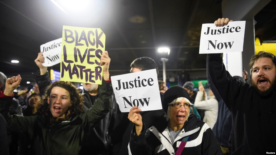 Black Lives Matter protesters chant slogans at the Mall of America light rail station in Bloomington, Minnesota, Dec. 23, 2015.