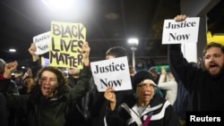 Black Lives Matter protesters chant slogans at the Mall of America light rail station in Bloomington, Minnesota, Dec. 23, 2015.