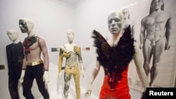 A variety of stage costumes worn by musician David Bowie are seen at the "David Bowie is" Exhibition at the Victoria and Albert Museum in London, March 20, 2013.