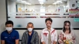 Thai Red Cross staff wearing Halloween costumes pose as people queue to donate blood at the National Blood Center of the Thai Red Cross Society in Bangkok, Thailand, Oct. 31, 2024. 