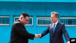 FILE - North Korean leader Kim Jong Un, left, met with South Korean President Moon Jae-in, April 27, 2018, at the border village of Panmunjom in Demilitarized Zone. 
