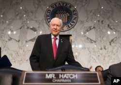 FILE - Senate Finance Committee Chairman Orrin Hatch, R-Utah, arrives to work on overhauling the nation's tax code, on Capitol Hill in Washington.
