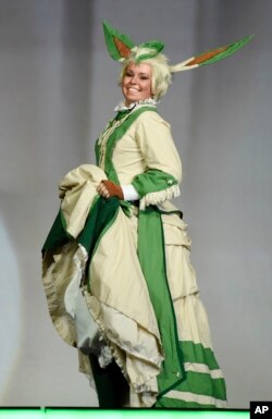 Dorothy Thicket, performing as "Victorian Leafeon," poses for the audience during the 41st Annual Comic-Con Masquerade costume competition in San Diego, California, July 11, 2015.