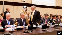 FILE - Saudi Arabia's Deputy Defense Minister Mohammed Alayeesh, center, speaks with U.S. Secretary of Defense Jim Mattis, center right, during a meeting of the counter-Islamic State Coalition at NATO headquarters in Brussels, Feb. 16, 2017. A similar meeting will be held at the U.S. State Department in Washington Wednesday.