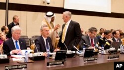 FILE - Saudi Arabia's Deputy Defense Minister Mohammed Alayeesh, center, speaks with U.S. Secretary of Defense Jim Mattis, center right, during a meeting of the counter-Islamic State Coalition at NATO headquarters in Brussels, Feb. 16, 2017. A similar meeting will be held at the U.S. State Department in Washington Wednesday.