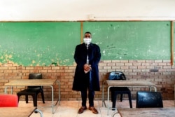 Mr. Gwala, headmaster of the Ithute Higher Primary School, poses for a portrait in an empty classroom in Alexandra, Johannesburg, on June 1, 2020.