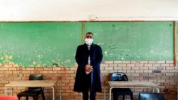 FILE - The headmaster of the Ithute Higher Primary School, poses for a portrait in an empty classroom in Alexandra, Johannesburg, June 1, 2020.