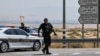 Israeli security forces gather at the scene of a reported attack near the Allenby Crossing between the occupied West Bank and Jordan on Sept. 8, 2024, where the Israeli military said a truck driver opened fire, killing three Israelis.