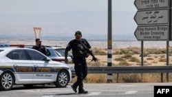 Israeli security forces gather at the scene of a reported attack near the Allenby Crossing between the occupied West Bank and Jordan on Sept. 8, 2024, where the Israeli military said a truck driver opened fire, killing three Israelis.