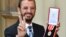 Ringo Starr, whose real name is Richard Starkey, poses after receiving his Knighthood at an Investiture ceremony at Buckingham palace in London, Britain, March 20, 2018. 