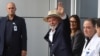 Brazil's President Luiz Inacio Lula da Silva, waves while leaves the Sirio-Libanes Hospital after a surgery, in Sao Paulo, Dec. 15, 2024. 