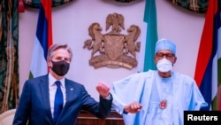 Secretário de Estado americano, Antony Blinken, e o Presidente na Nigéria, Muhammadu Buhari em Abuja, Nigeria, 18 de Novembro de 2021