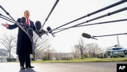 President Donald Trump speaks to reporters before boarding Marine One on the South Lawn of the White House in Washington, Tuesday, March 13, 2018, to travel to Andrews Air Force Base, Md.
