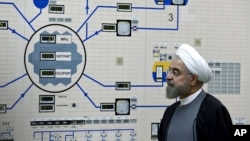 FILE - Iran's President Hassan Rouhani is seen during a visit to the Bushehr nuclear power plant in southern Iran, Jan. 13, 2015. 