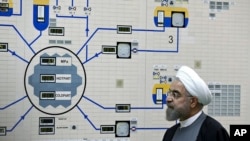 FILE - Iran's President Hassan Rouhani visits the Bushehr nuclear power plant, Jan. 13, 2015. Moscow has removed most of the country's enriched uranium, a Russian envoy said. 