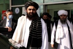 The Taliban delegation led by Amir Khan Muttaqi, the acting foreign minister, front, at Esenboga Airport, arrive in Ankara, Turkey, Oct. 14, 2021.