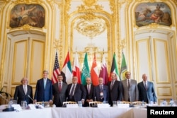 U.S. Secretary of State John Kerry (2nd L) with foreign ministers of the Gulf Cooperation Council as they meet to discuss Middle East concerns at the Chief of Mission Residence in Paris, May 8, 2015.