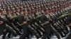 FILE - North Korean soldiers march during a military parade in Pyongyang's Kim Il Sung Square, April 15, 2012. A video purporting to show North Korean recruits lining up to collect Russian military fatigues and gear aims to intimidate Ukraine as it defends itself from Russia.