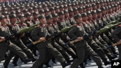 FILE - North Korean soldiers march during a military parade in Pyongyang's Kim Il Sung Square, April 15, 2012. A video purporting to show North Korean recruits lining up to collect Russian military fatigues and gear aims to intimidate Ukraine as it defends itself from Russia.