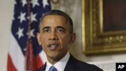 President Barack Obama speaks in the State Dining Room at the White House about the nuclear deal between six world powers and Iran that calls on Tehran to limit its nuclear activities in return for sanctions relief, 11/23/13 (AP Photo/Susan Walsh)