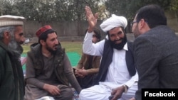FILE - Manzoor Pashteen, the leader of a Pashtun movement, is seen wearing a red and black hat, being called a "Pashteen hat," in this undated photo from Facebook.