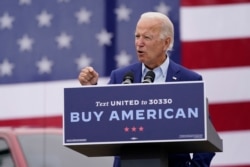 FILE - Democratic presidential candidate former Vice President Joe Biden speaks at a campaign event on manufacturing and buying American-made products at UAW Region 1 headquarters in Warren, Michigan, Sept. 9, 2020.
