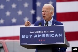 FILE - Democratic presidential candidate former Vice President Joe Biden speaks at a campaign event on manufacturing and buying American-made products at UAW Region 1 headquarters in Warren, Michigan, Sept. 9, 2020.