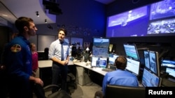 Canadian Prime Minister Justin Trudeau and his daughter Ella Grace are shown the control center by Astronaut Joshua Kutryk at Canadian Space Agency in Longueuil, Quebec, Feb. 28, 2019. 