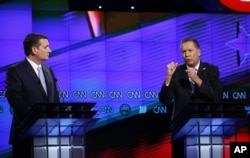 FILE - Ohio Gov. John Kasich, right, speaks as Sen. Ted Cruz of Texas listens during the Republican presidential candidates debate sponsored by CNN, Salem Media Group and the Washington Times at the University of Miami in Coral Gables, Fla., March 10, 2016.