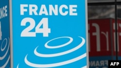 FILE - This photograph taken on April 9, 2019, shows the logo of the live news channel France 24 at Issy-les-Moulineaux, near Paris. 