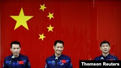 Chinese astronauts meet members of the media at Jiuquan Satellite Launch Center, June 15, 2021.