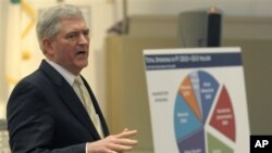 Republican Representative Daniel Webster talks about the current fiscal budget during a crowded town hall meeting in Orlando, Florida, April 26, 2011