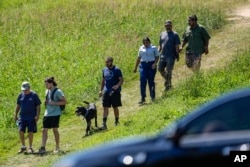 People leave Apalachee High School after a shooting at the school in Winder, Georgia, Wednesday, Sept. 4, 2024.