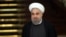 FILE - Iranian President Hassan Rouhani attends a joint press conference with his Chinese counterpart Xi Jinping after their meeting at the Saadabad Palace in Tehran, Iran, Jan. 23, 2016. 
