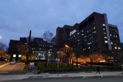 Pedestrians pass Brooklyn Hospital Center on April 4, 2020, in the Brooklyn borough of New York.