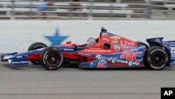 Marco Andretti drives through Turn 4 during the IndyCar auto race, June 8, 2013, in Fort Worth, Texas. 