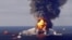 Fire boat response crews battle the blazing remnants of the offshore oil rig Deepwater Horizon, off Louisiana, in this April 21, 2010 handout image. 
