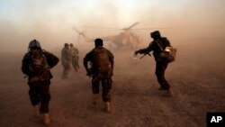 Afghan army commandos train at the Shorab military base in Helmand province, Afghanistan, Aug. 27, 2017. The Taliban attacked the base Friday in a pre-dawn assault. 