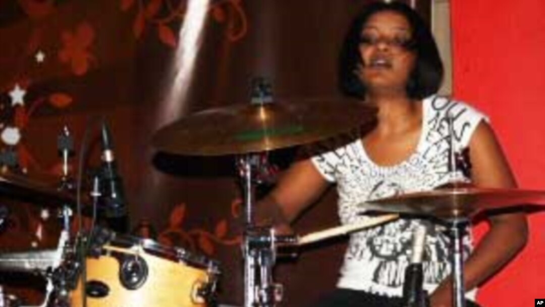 Bianca Nobanda pounds the drums....She's a rarity in modern rock music: a black African woman
