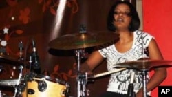 Bianca Nobanda pounds the drums....She's a rarity in modern rock music: a black African woman