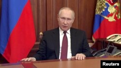 FILE PHOTO: Russian President Vladimir Putin delivers a video address in Moscow