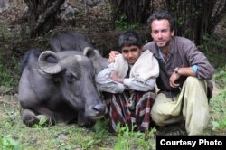 Michael Benanav with Sharafat. The 16-year-old was like a younger brother to Benanav during the six weeks that the photographer lived with his family. This photo was taken by Chamar on day 38 of the journey.