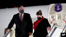 FILE - Secretary of State Mike Pompeo and his wife, Susan, step off a plane at Tbilisi International Airport in Tbilisi, Georgia, Nov. 17, 2020. 